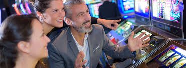 ibet44 login Ganesha Gold slot game interface with five reels and live-dealer video feed